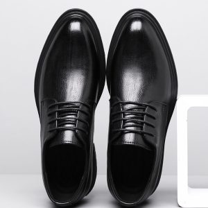 Elevator shoes with built-in height increase insoles, stylish black leather dress shoes designed to add extra height discreetly. Suitable for formal occasions and professional settings.