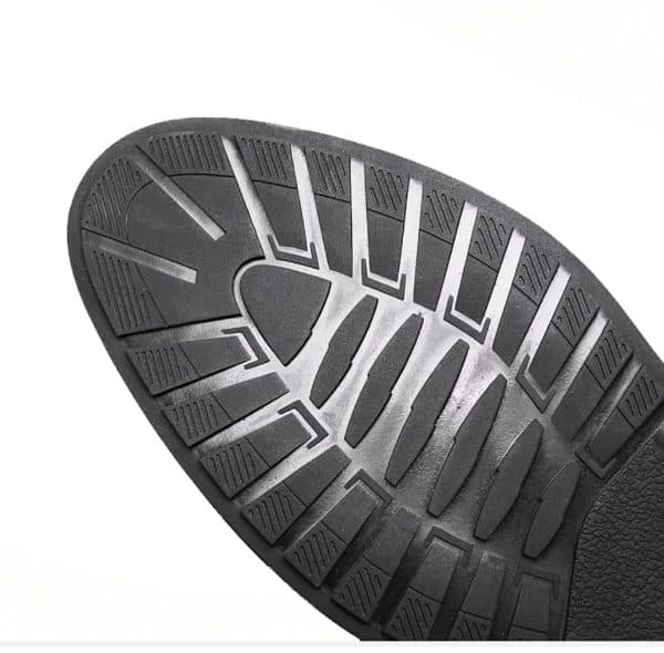 Enhanced black sole of elevator shoes with ergonomic design and tread pattern for increased height and comfort.
